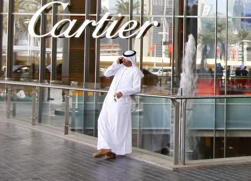 Man using smartphone in Dubai Downtown