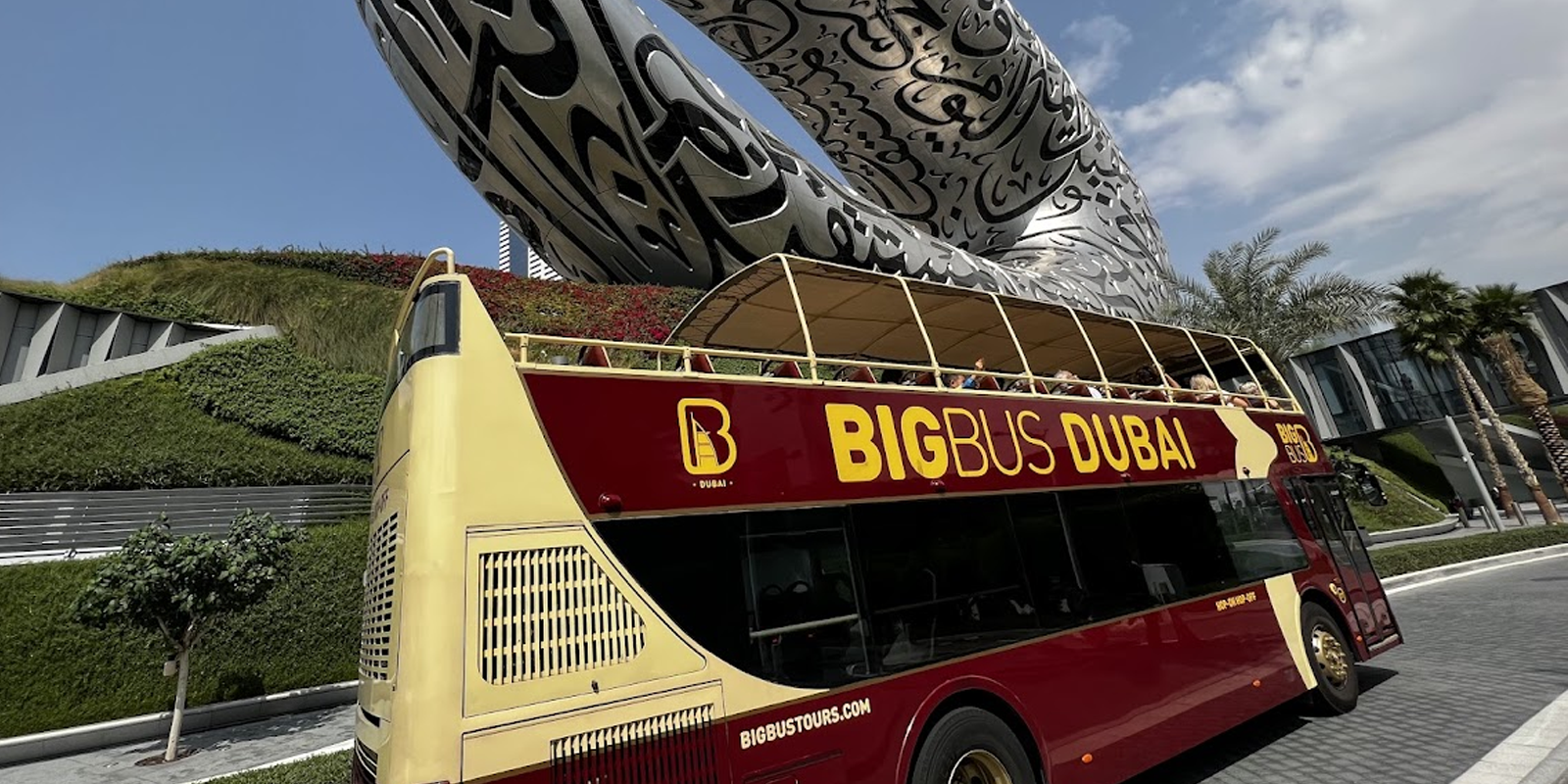 Red Big Bus double-decker tour bus in Dubai with Burj Khalifa in the background